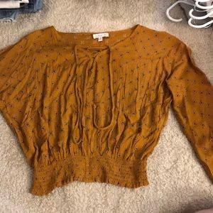 Blouse with tethered bottom